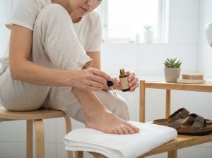 How can you safely wear open-toed shoes while treating a fungal nail?