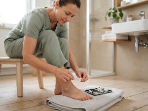 How can you safely trim and file a severely thickened fungal toenail?